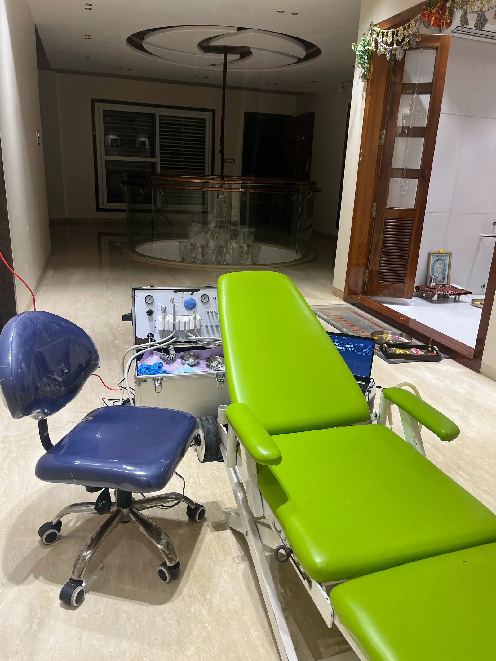 Prudentoe portable dental chair and equipment case set up inside a patient's home in Hyderabad