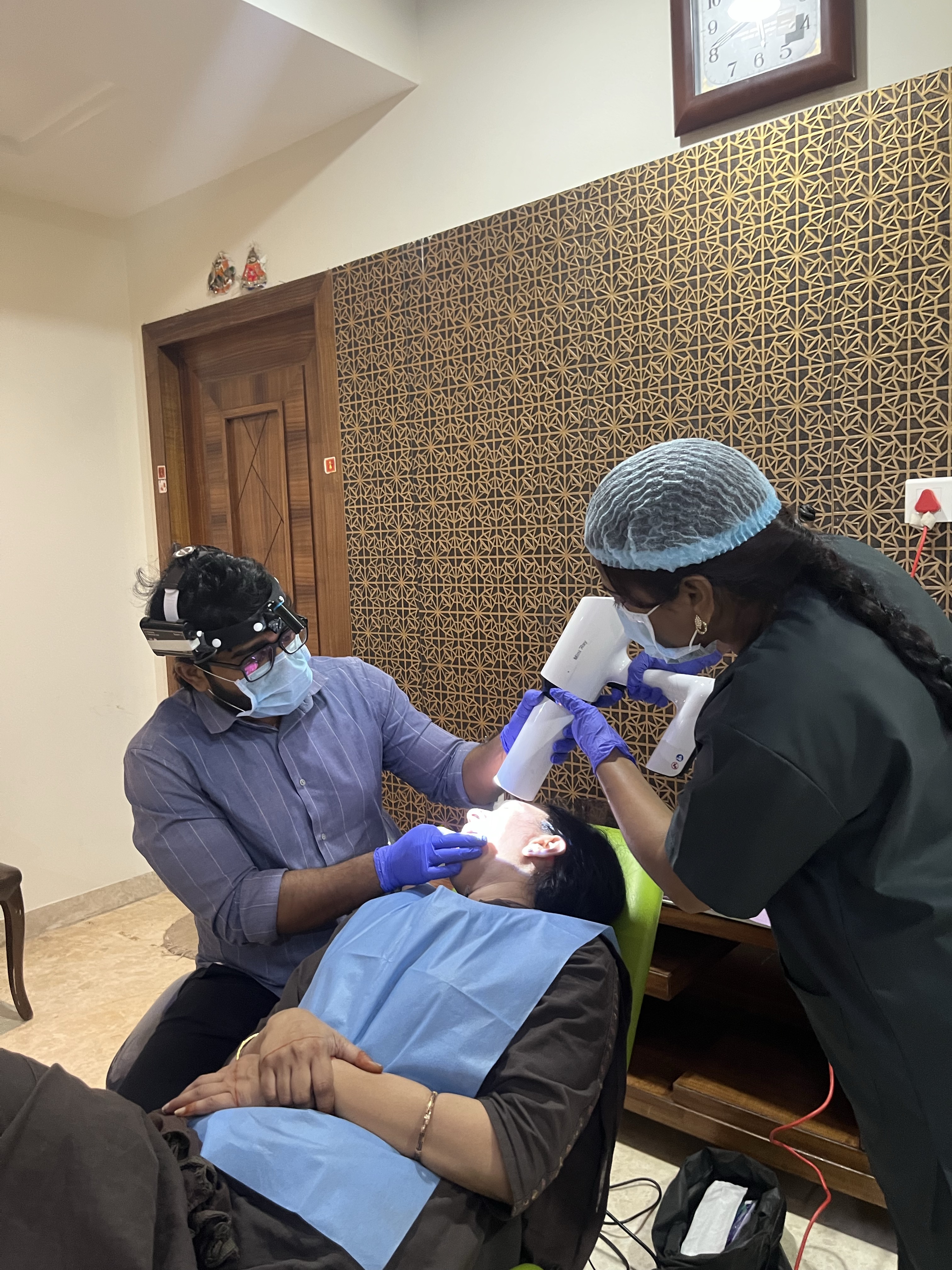 Prudentoe dental team performing a dental examination at a patient's home in Hyderabad