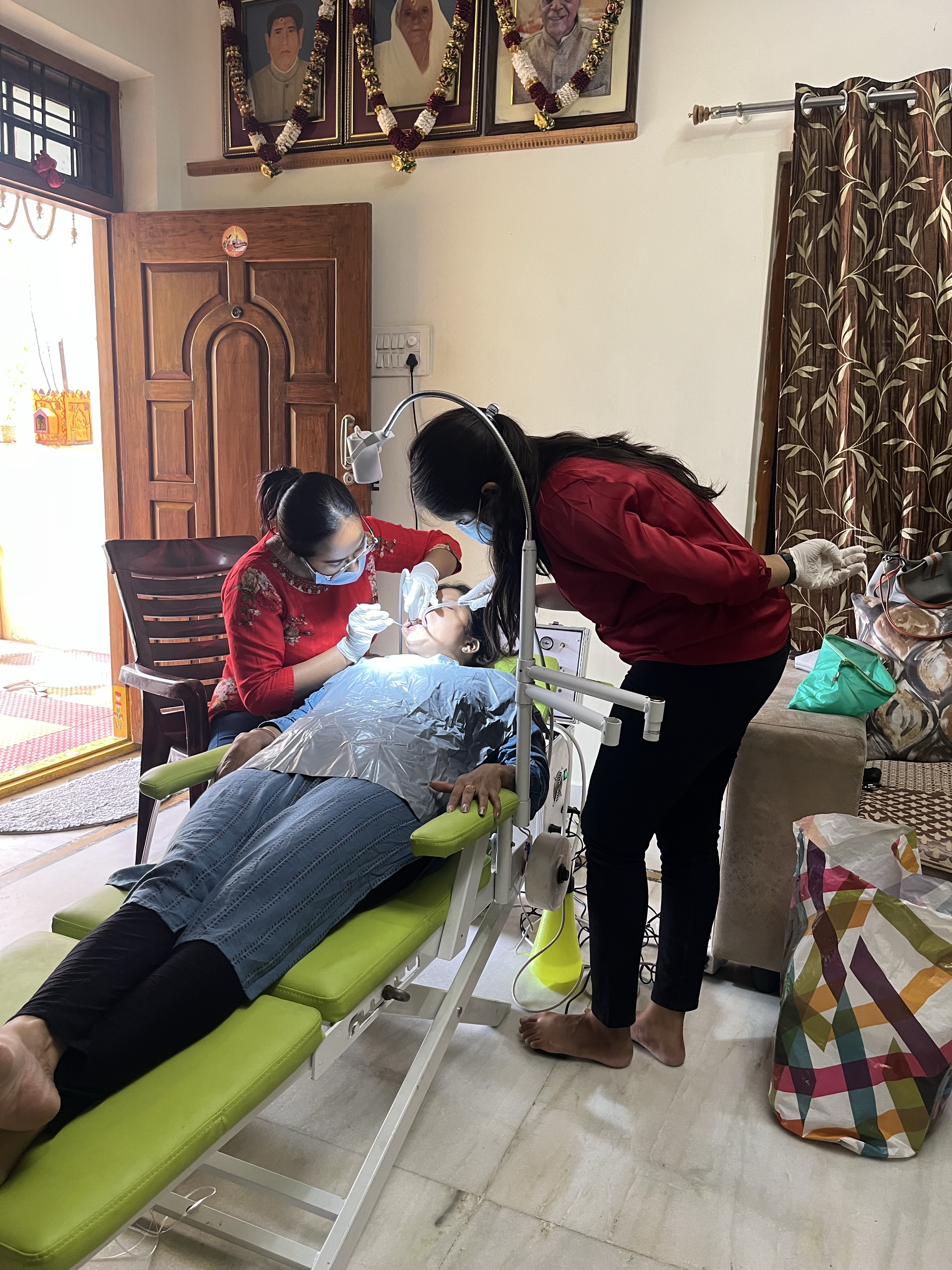 Prudentoe dentists on a doorstep dental visit treating a patient at their home in Hyderabad
